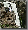 Local kids take an up-close and personal look of the falls.