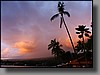 A heavy shower descending on Kailua-Kona at sunset.