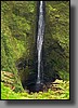 A stunning waterfall was flowing down the side of the valley.